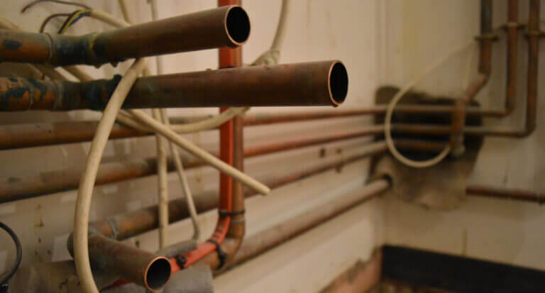 Copper pipework affixed to a wall