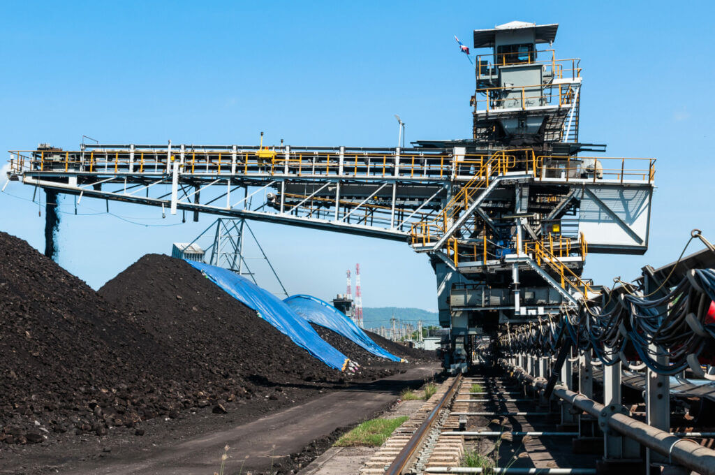 Coal Stacker and Coal Reclaimer stacking coal under a tarpaulin cover