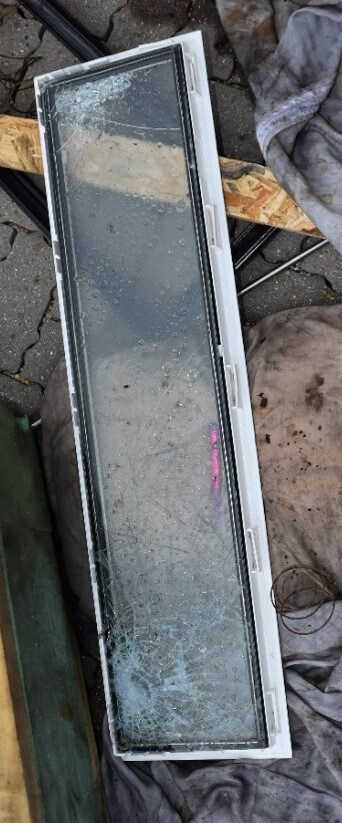 Impact damaged glass panel from a previous Hawkins case