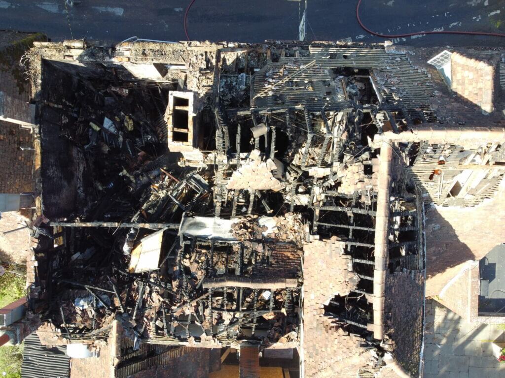 A drone image of buildings severely damaged by fire