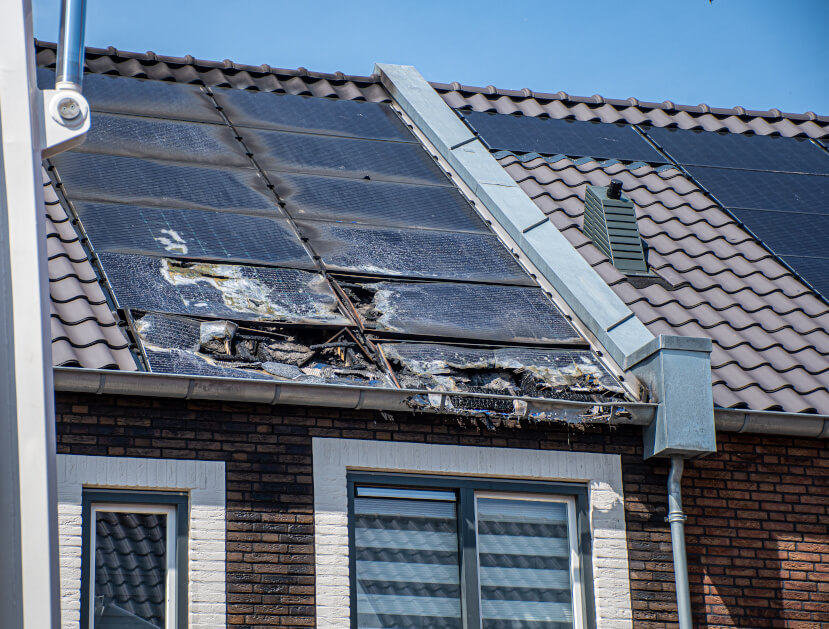 Fire Damaged Solar Panels on the Roof of a Residential Property